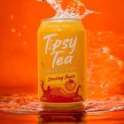 Tipsy Tea Peach Red Background